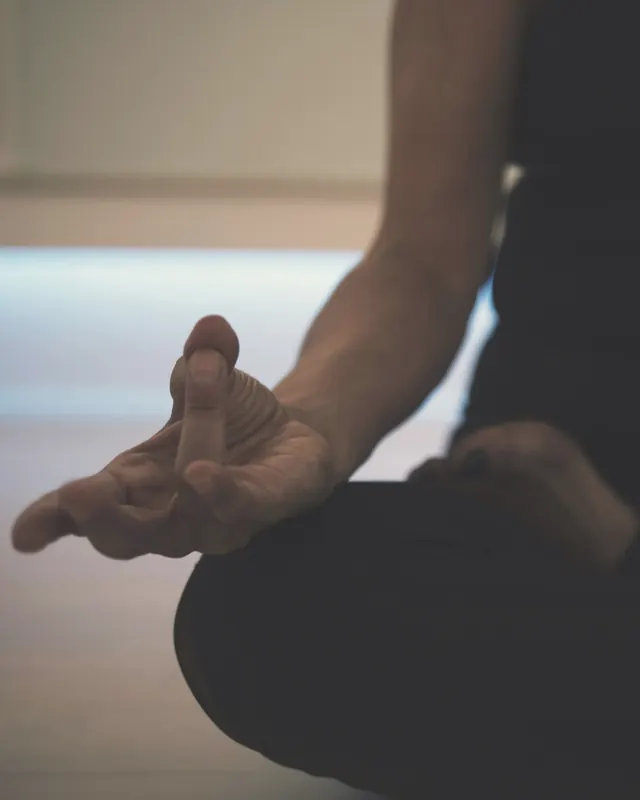 Hands resting open in a lap during a quiet moment of stillness